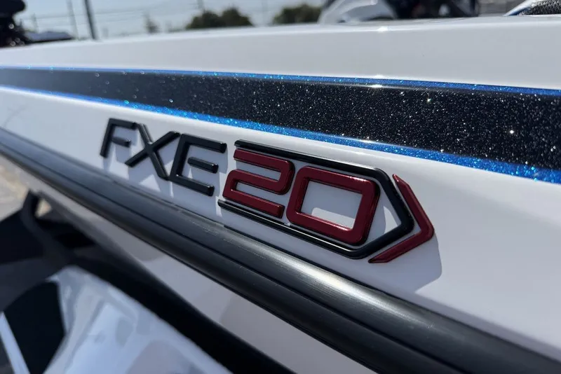 Slide: The Image of 2027 Skeeter FXE20 Limited boat logo with glittering blue accent. - 10