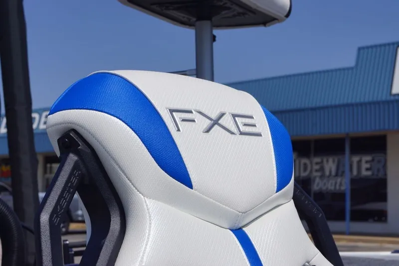 Slide: The Image of 2027 Skeeter FXE20 Limited boat seat with blue and white design. - 14