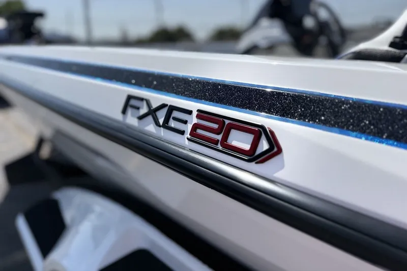 Slide: The Image of Close-up of 2027 Skeeter FXE20 Limited boat logo on sleek white surface. - 16