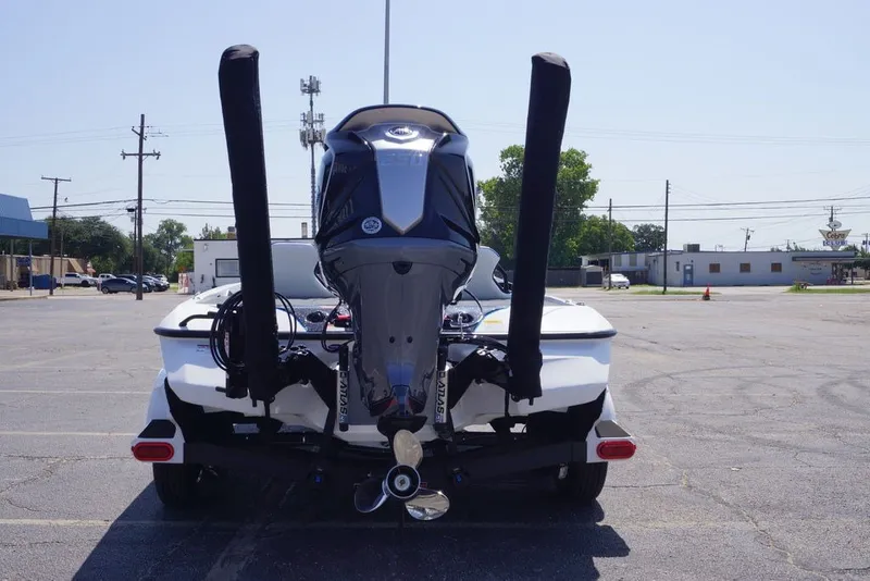 Slide: The Image of 2027 Skeeter FXE20 Limited boat rear view in a parking lot. - 6