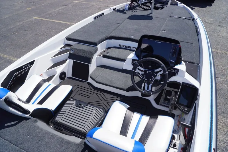 Slide: The Image of 2027 Skeeter FXE20 Limited boat interior with advanced dashboard and seating. - 17