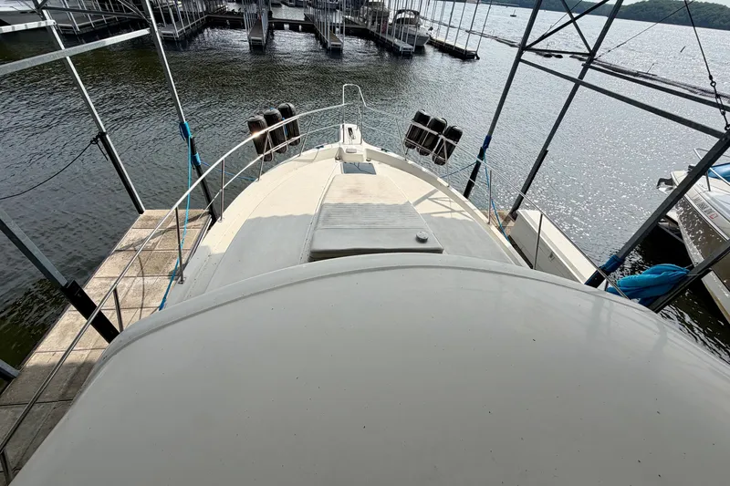Slide: The Image of 1994 Carver 440 Aft Cabin Motor Yacht docked at marina, viewed from above. - 10
