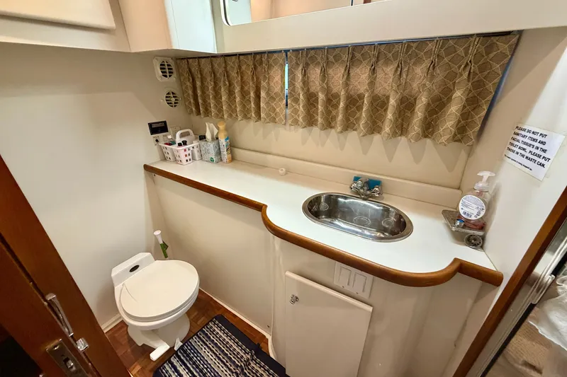 Slide: The Image of Bathroom interior of 1994 Carver 440 Aft Cabin Motor Yacht with sink and toilet. - 27