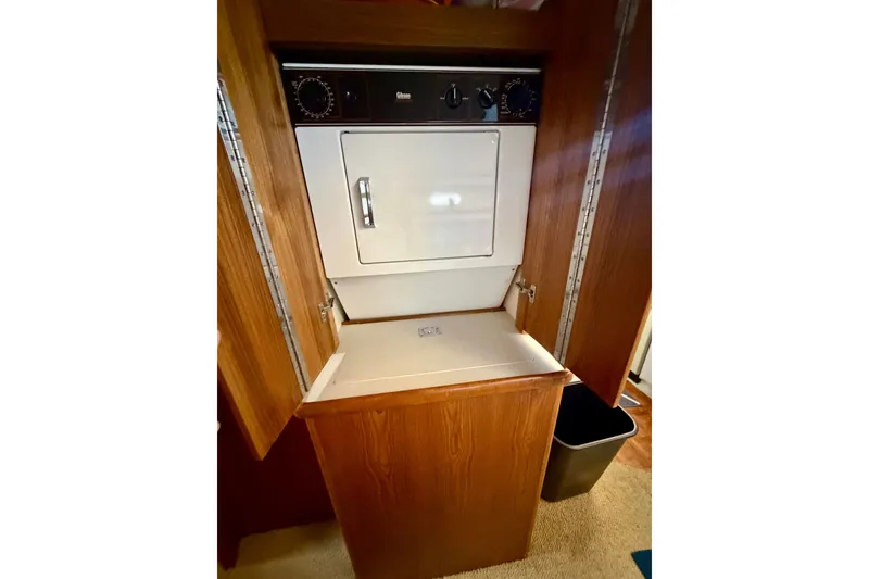 Slide: The Image of Laundry area in 1994 Carver 440 Aft Cabin Motor Yacht with built-in dryer. - 20