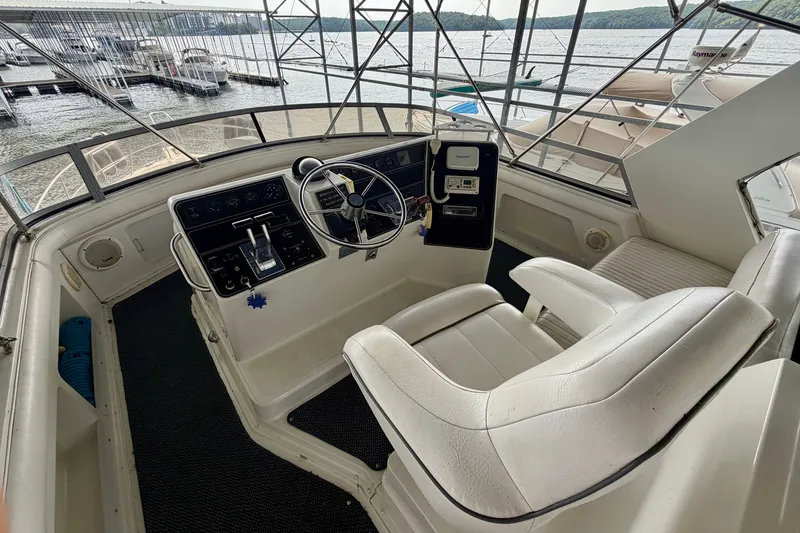 Slide: The Image of Cockpit of 1994 Carver 440 Aft Cabin Motor Yacht with steering wheel and controls. - 6