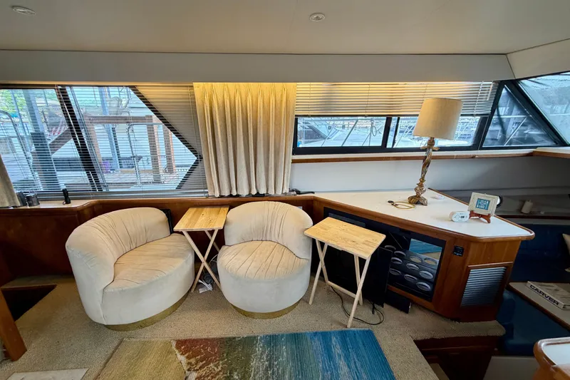 Slide: The Image of Interior of 1994 Carver 440 Aft Cabin Motor Yacht with cozy seating area. - 16