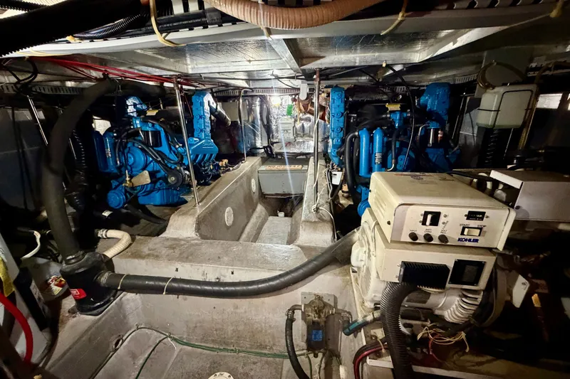 Slide: The Image of Engine room of a 1994 Carver 440 Aft Cabin Motor Yacht with visible machinery. - 29