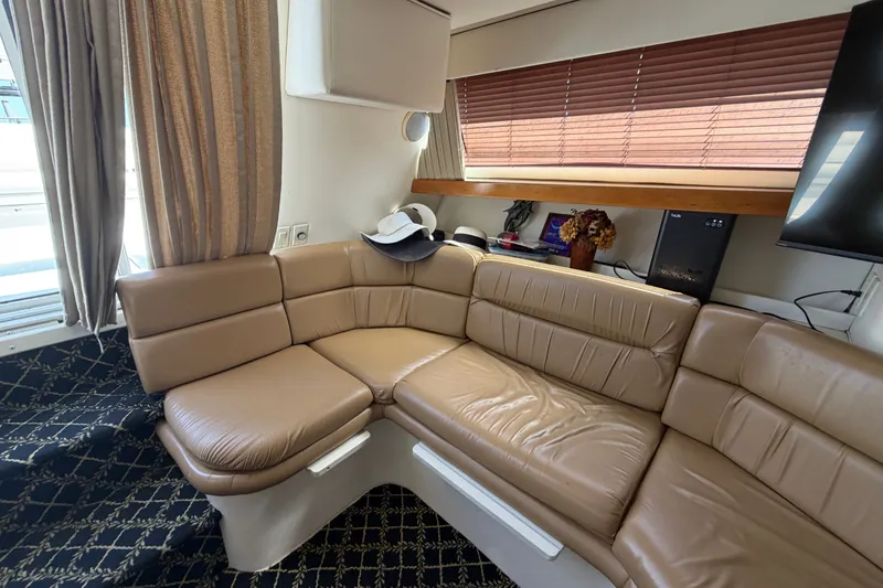 Slide: The Image of Luxurious interior of 2001 Carver 380 Santego SE yacht with beige leather seating. - 13