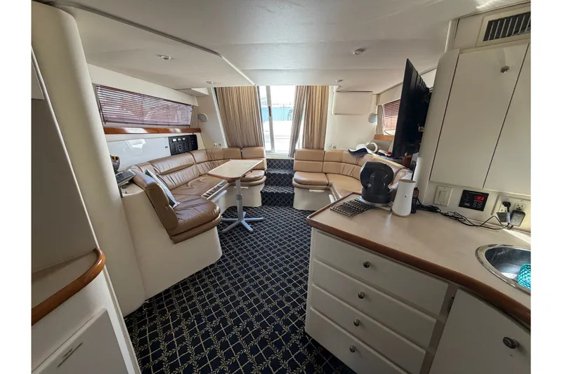 Slide: The Image of Interior of 2001 Carver 380 Santego SE yacht with luxurious seating and modern amenities. - 19