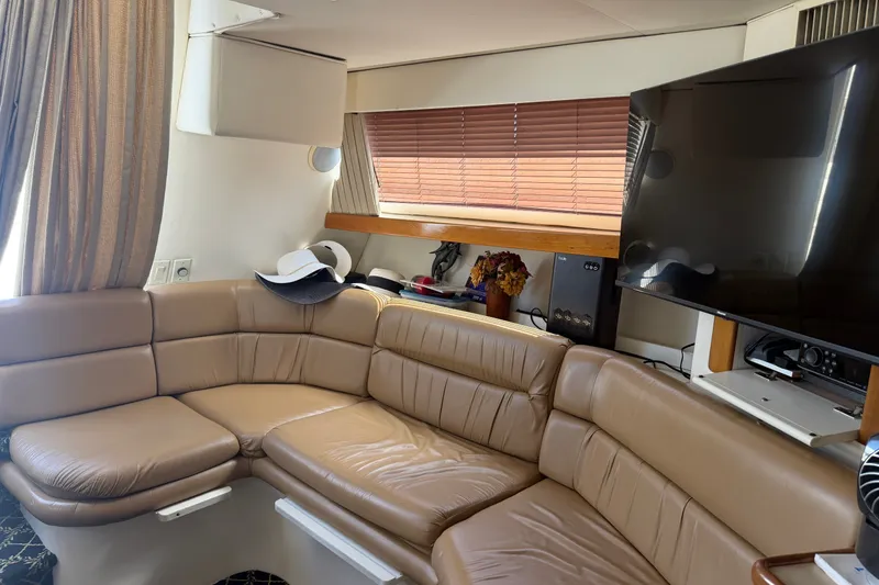Slide: The Image of Luxurious interior of 2001 Carver 380 Santego SE yacht with leather seating and TV. - 11
