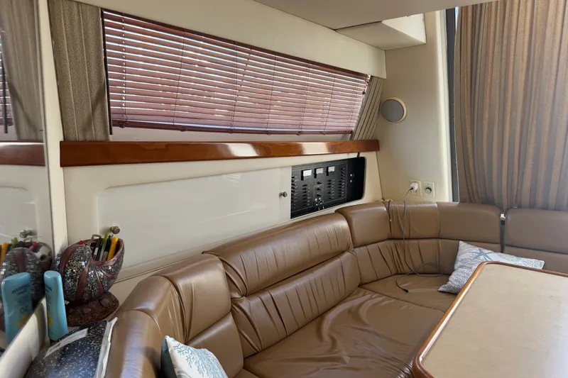 Slide: The Image of Interior of 2001 Carver 380 Santego SE yacht with leather seating and wooden blinds. - 12