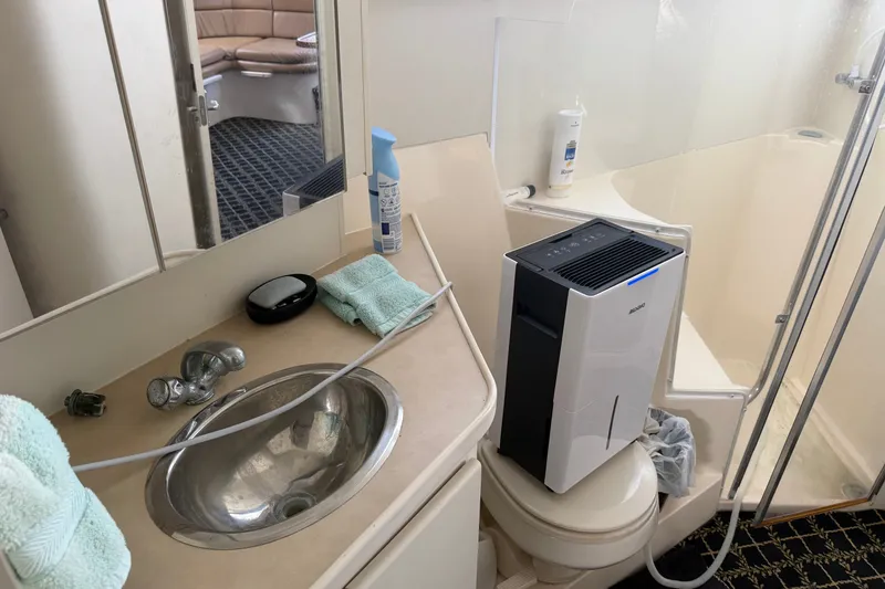 Slide: The Image of Bathroom interior of a 2001 Carver 380 Santego SE yacht with sink and air purifier. - 9