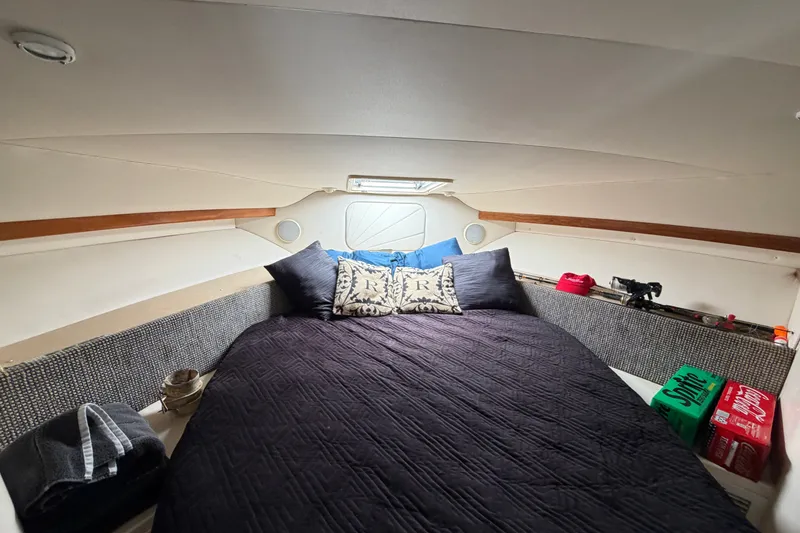 Slide: The Image of Interior cabin of 2001 Carver 380 Santego SE with cozy bedding and storage. - 17
