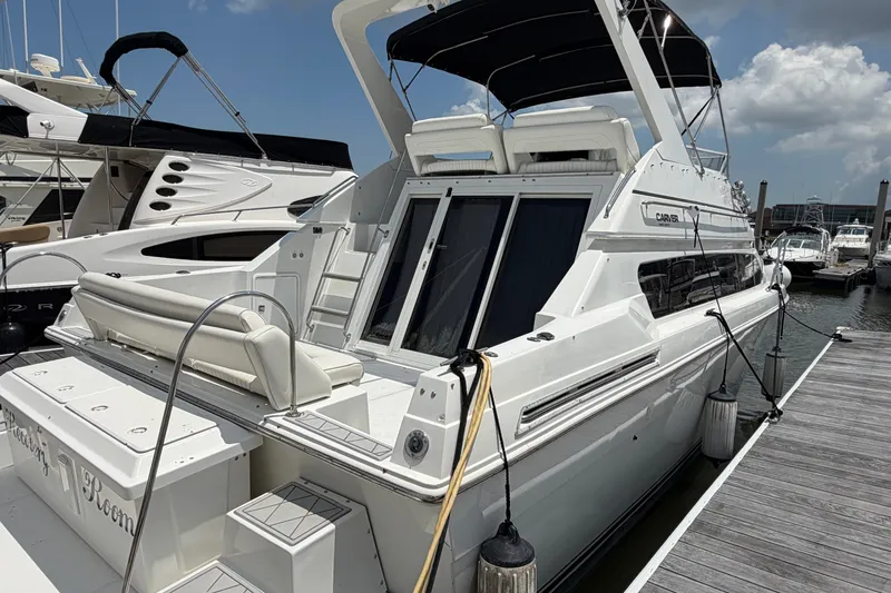 Slide: The Image of 2001 Carver 380 Santego SE yacht docked at marina under clear sky. - 3
