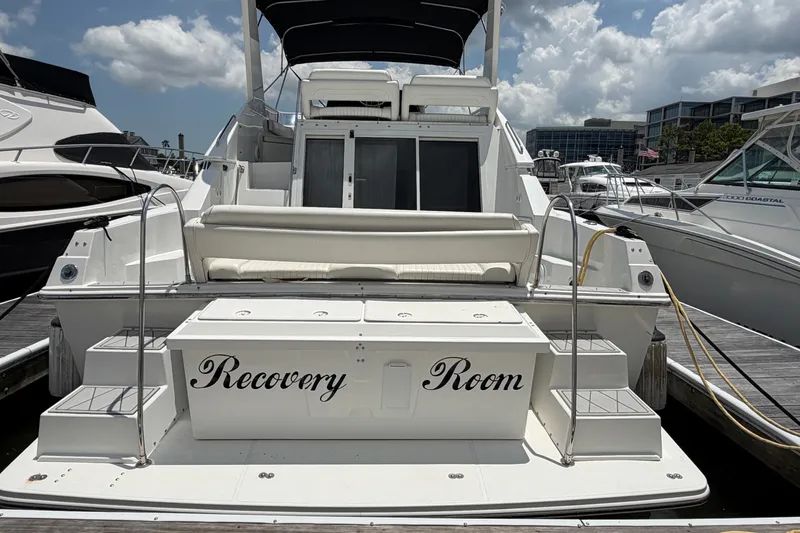 Slide: The Image of 2001 Carver 380 Santego SE yacht named "Recovery Room" docked at marina. - 2