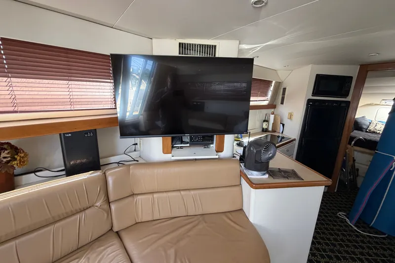 Slide: The Image of Interior of 2001 Carver 380 Santego SE yacht with TV and seating area. - 15