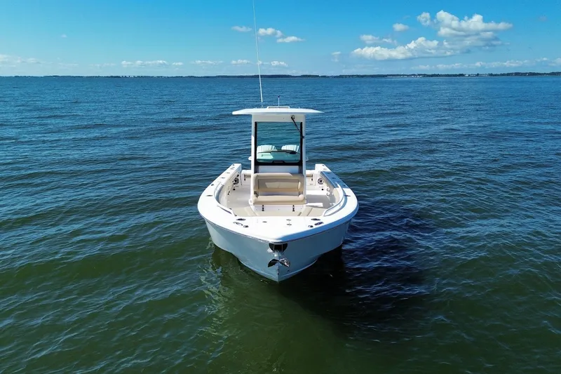 Slide: The Image of Everglades 273 Center Console boat on open water, 2022 model, under clear blue sky. - 6