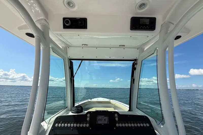 Slide: The Image of Interior view of 2022 Everglades 273 Center Console boat on open water. - 21