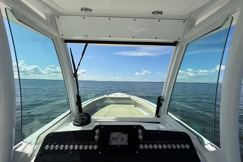 Slide: The Image of Interior view of 2022 Everglades 273 Center Console boat on open water. - 22