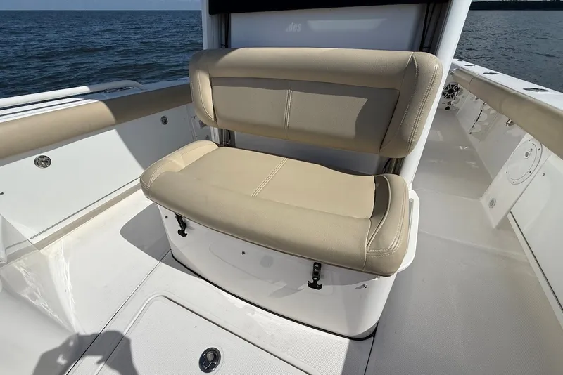 Slide: The Image of Beige seating on 2022 Everglades 273 Center Console boat, ocean backdrop. - 27