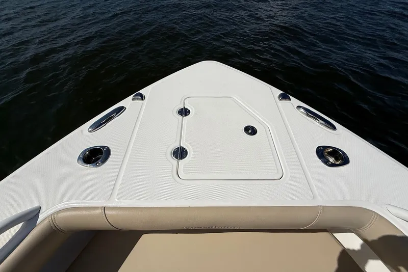 Slide: The Image of Bow of 2022 Everglades 273 Center Console boat on water. - 31