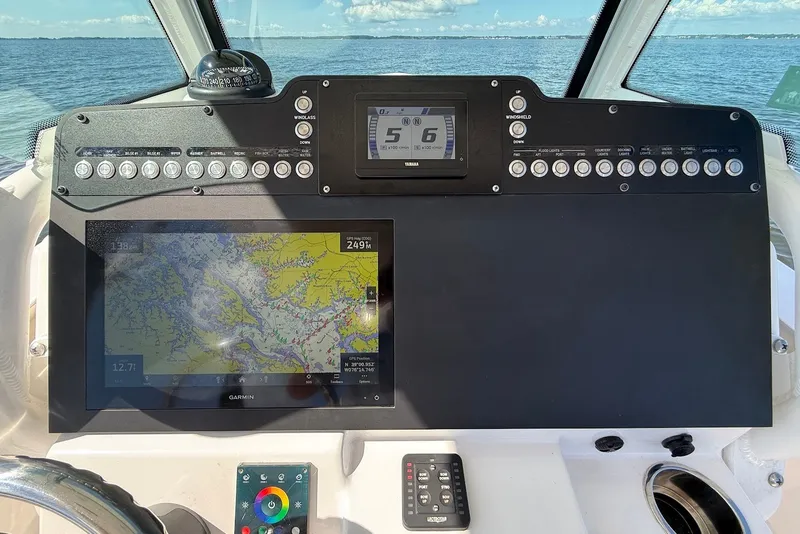 Slide: The Image of 2022 Everglades 273 Center Console dashboard with navigation and control panels. - 20