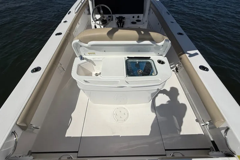 Slide: The Image of 2022 Everglades 273 Center Console boat interior with open storage compartment. - 14