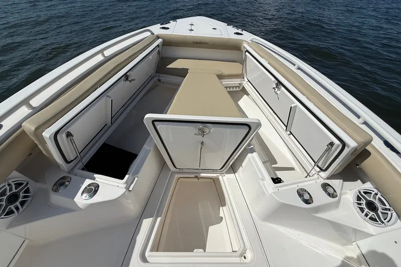 Slide: The Image of 2022 Everglades 273 Center Console boat interior with storage compartments and seating. - 30