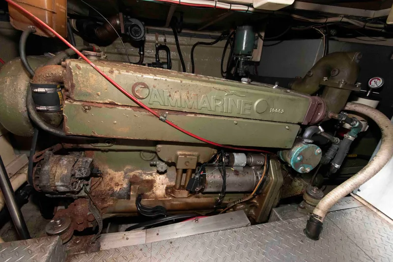 Slide: The Image of Engine room of a 1974 Grand Banks 42 Classic boat, featuring an AMMARINE engine. - 33