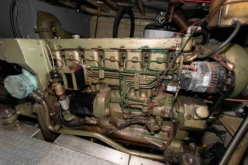 Slide: The Image of Engine room of a 1974 Grand Banks 42 Classic boat, showcasing detailed machinery. - 32
