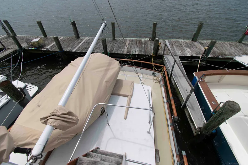 Slide: The Image of 1974 Grand Banks 42 Classic yacht docked at a marina, view from above. - 14