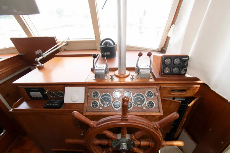 Slide: The Image of 1974 Grand Banks 42 Classic helm with wooden wheel and vintage gauges. - 21