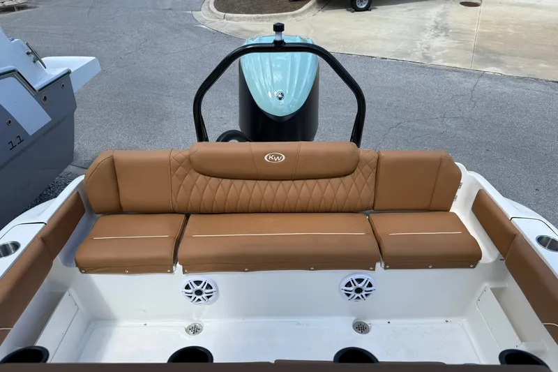 Slide: The Image of 2027 Key West 239 FS boat with tan leather seating and modern design. - 9