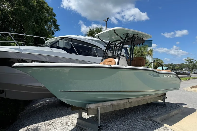 The Image of 2027 Key West 239 FS boat displayed outdoors under a clear blue sky. - 0