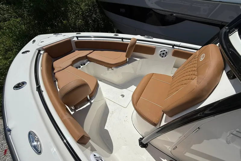 Slide: The Image of 2027 Key West 239 FS boat interior with tan leather seating and modern design. - 3
