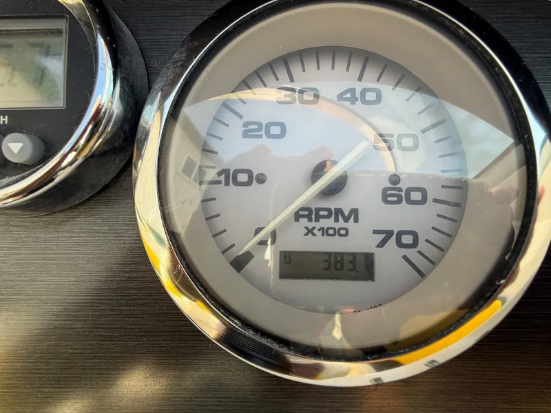 Slide: The Image of Close-up of a tachometer showing 383.1 RPM. - 17