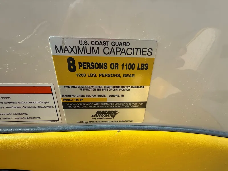 Slide: The Image of Capacity sign: 8 persons or 1100 lbs on a Sea Ray 185 Sport boat. - 25