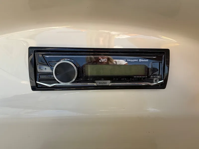Slide: The Image of A JVC car stereo is installed in the dashboard of a 2006 Sea Ray 185 Sport. - 18