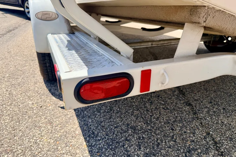 Slide: The Image of Trailer detail of a 2005 Princecraft Vacanza 210V O/B, featuring red tail light. - 71