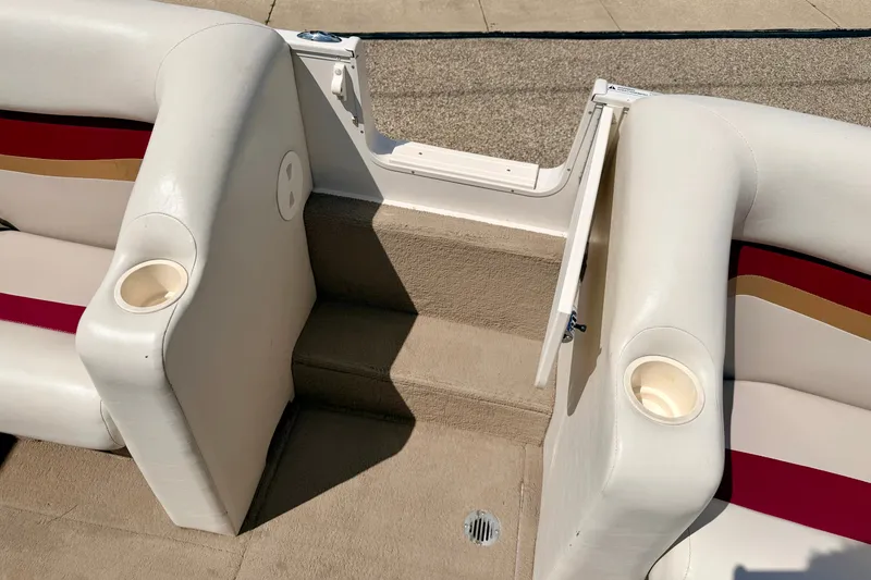Slide: The Image of 2005 Princecraft Vacanza 210V O/B boat interior with cup holders and seating. - 55