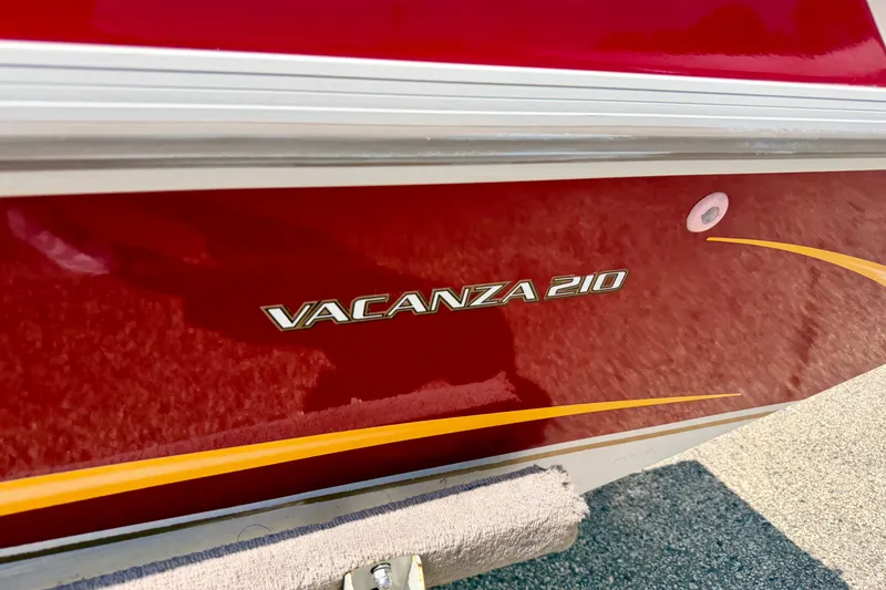 Slide: The Image of 2005 Princecraft Vacanza 210V O/B boat with red and yellow detailing. - 15