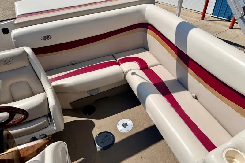 Slide: The Image of 2005 Princecraft Vacanza 210V O/B boat interior with beige and red seating. - 45