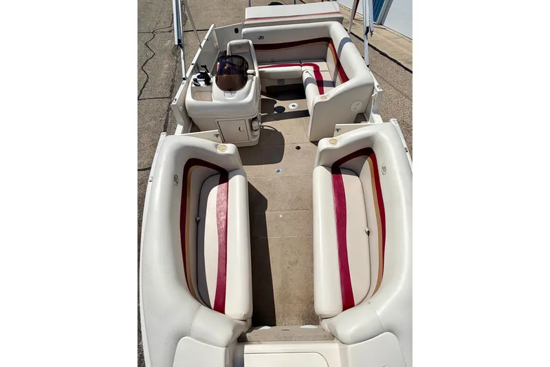 Slide: The Image of 2005 Princecraft Vacanza 210V O/B boat interior with red and white seating. - 51
