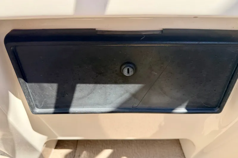 Slide: The Image of Lockable storage compartment on a 2005 Princecraft Vacanza 210V O/B boat. - 42