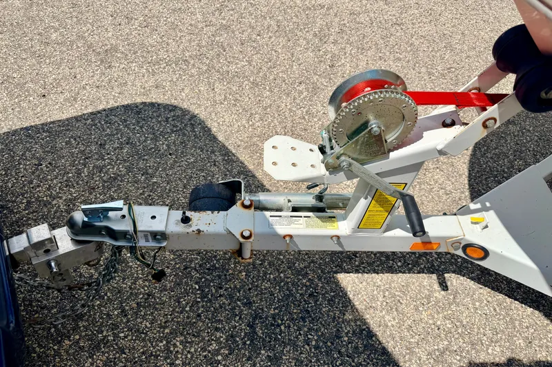 Slide: The Image of Trailer hitch and winch of a 2005 Princecraft Vacanza 210V O/B on asphalt. - 68