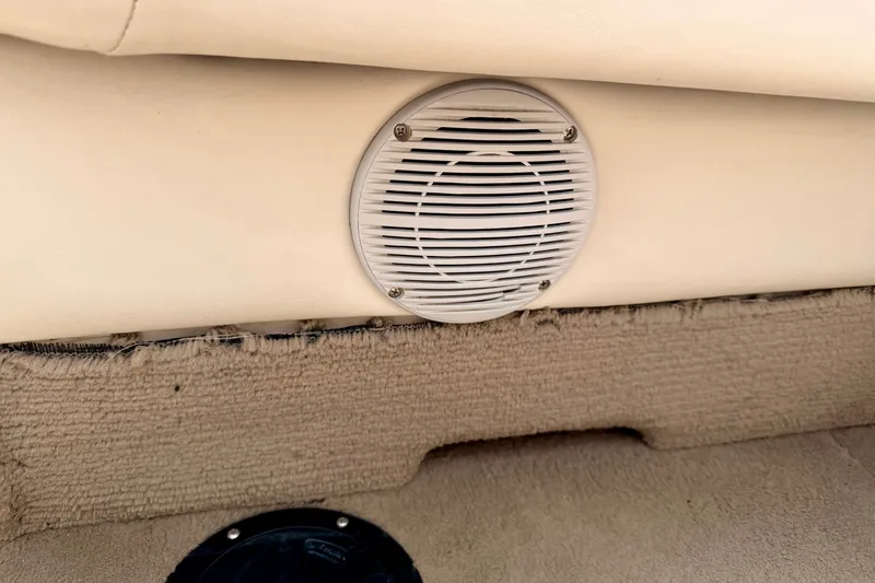 Slide: The Image of Speaker on a 2005 Princecraft Vacanza 210V O/B boat with beige interior. - 60