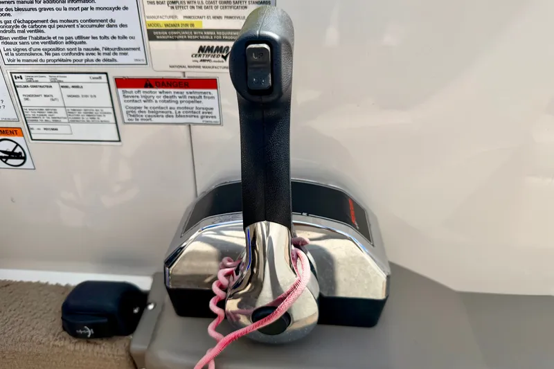 Slide: The Image of Throttle control of 2005 Princecraft Vacanza 210V O/B boat with safety warnings. - 40