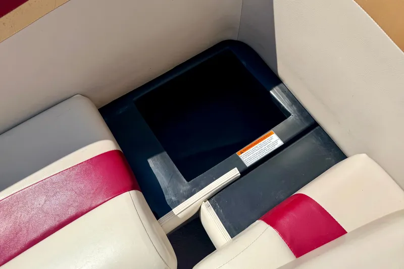 Slide: The Image of 2005 Princecraft Vacanza 210V O/B boat interior with red and white seating. - 29