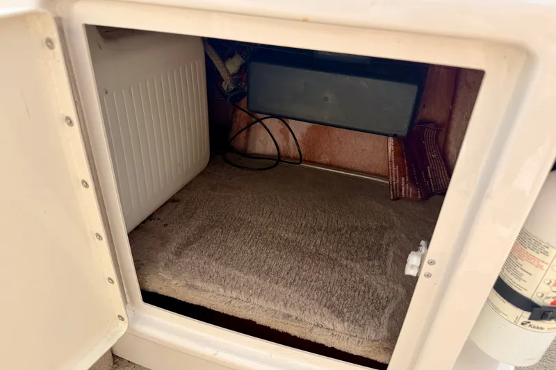 Slide: The Image of Open storage compartment in 2005 Princecraft Vacanza 210V O/B boat. - 57