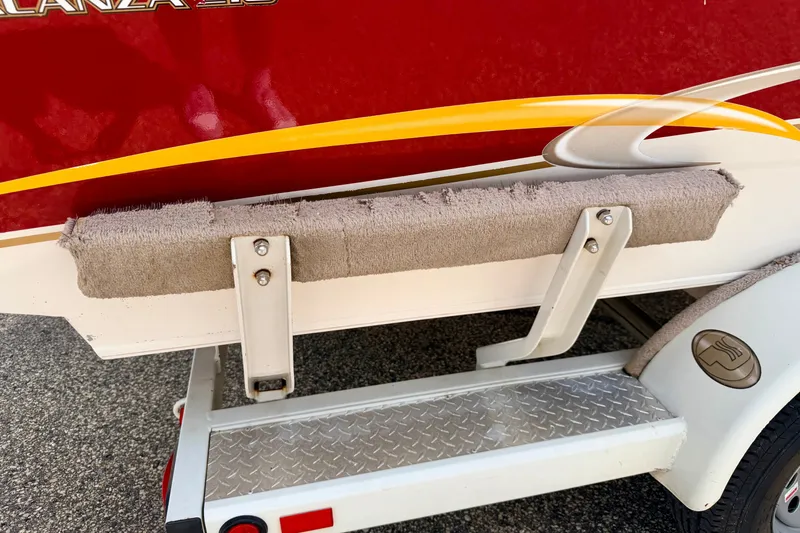 Slide: The Image of 2005 Princecraft Vacanza 210V O/B boat trailer with red and yellow detailing. - 73